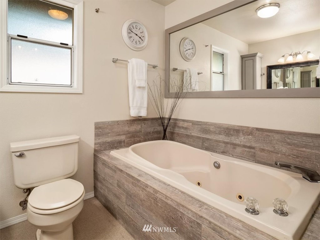 1919 243rd Place Southwest Bothell, WA 98021 - Photo 20 of 39 a bathroom with a toilet sink and mirror