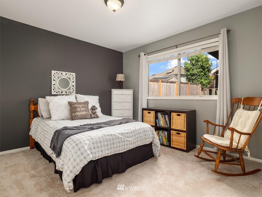1919 243rd Place Southwest Bothell, WA 98021 - Photo 21 of 39 a bedroom with a bed chair and a window