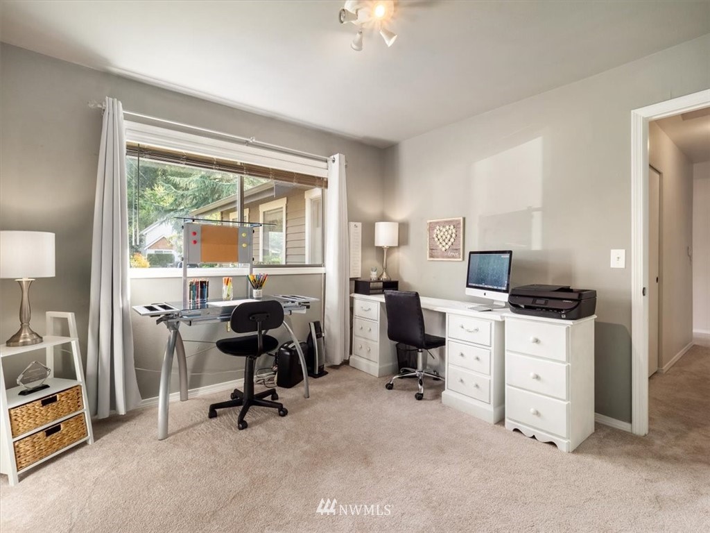 1919 243rd Place Southwest Bothell, WA 98021 - Photo 23 of 39 a view of a workspace with furniture and a window