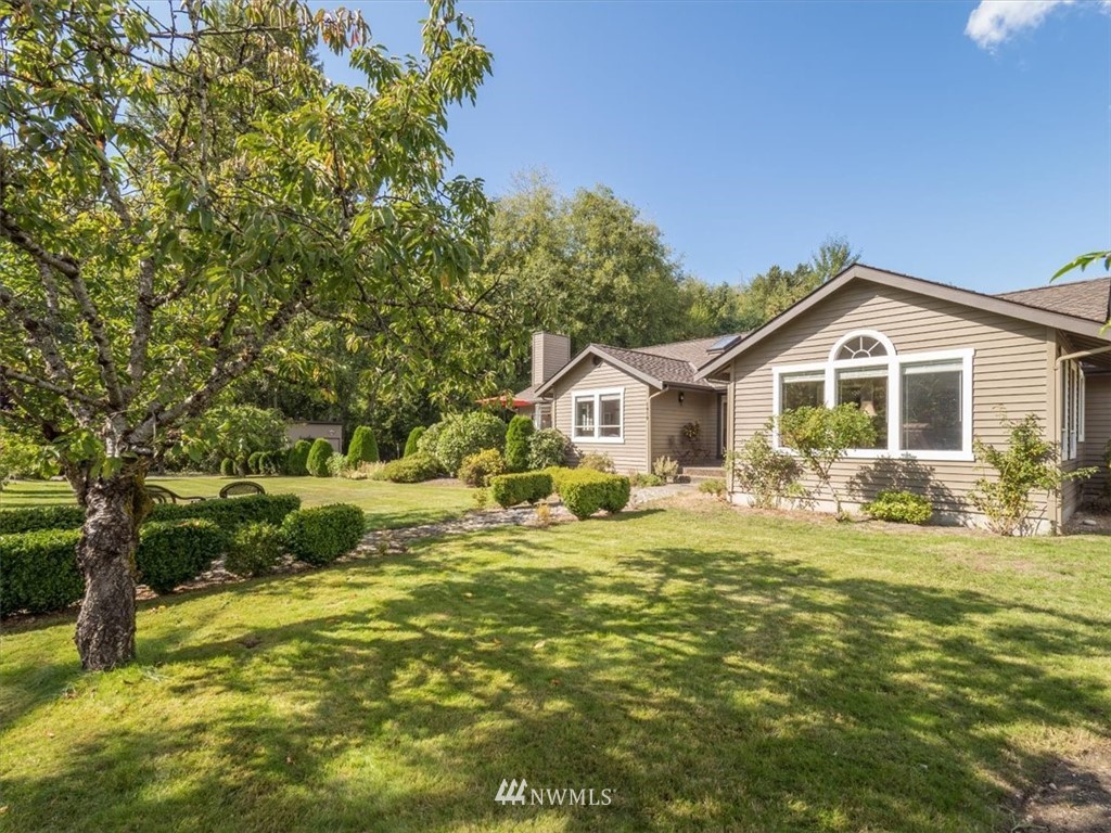 1919 243rd Place Southwest Bothell, WA 98021 - Photo 25 of 39 a front view of a house with a garden