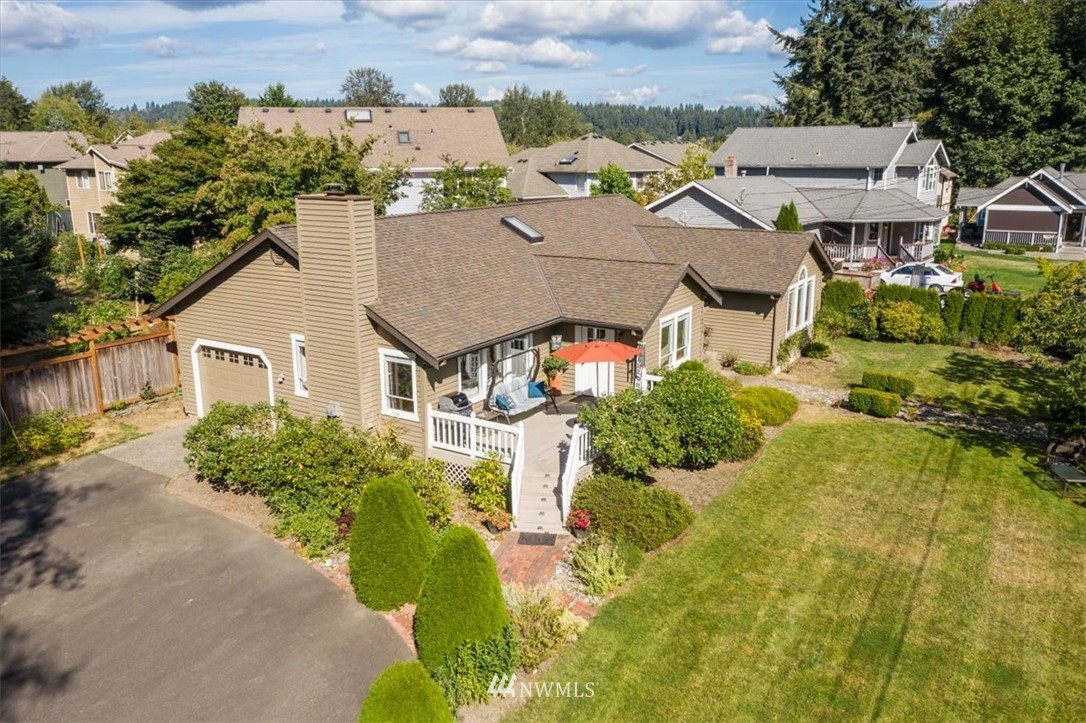1919 243rd Place Southwest Bothell, WA 98021 - Photo 30 of 39 an aerial view of residential houses with outdoor space and trees