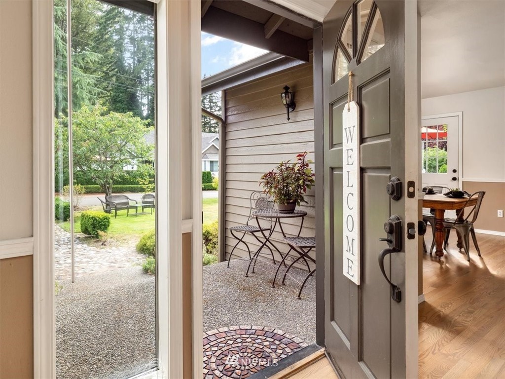 1919 243rd Place Southwest Bothell, WA 98021 - Photo 4 of 39 a view of entryway dining room and hall with wooden floor