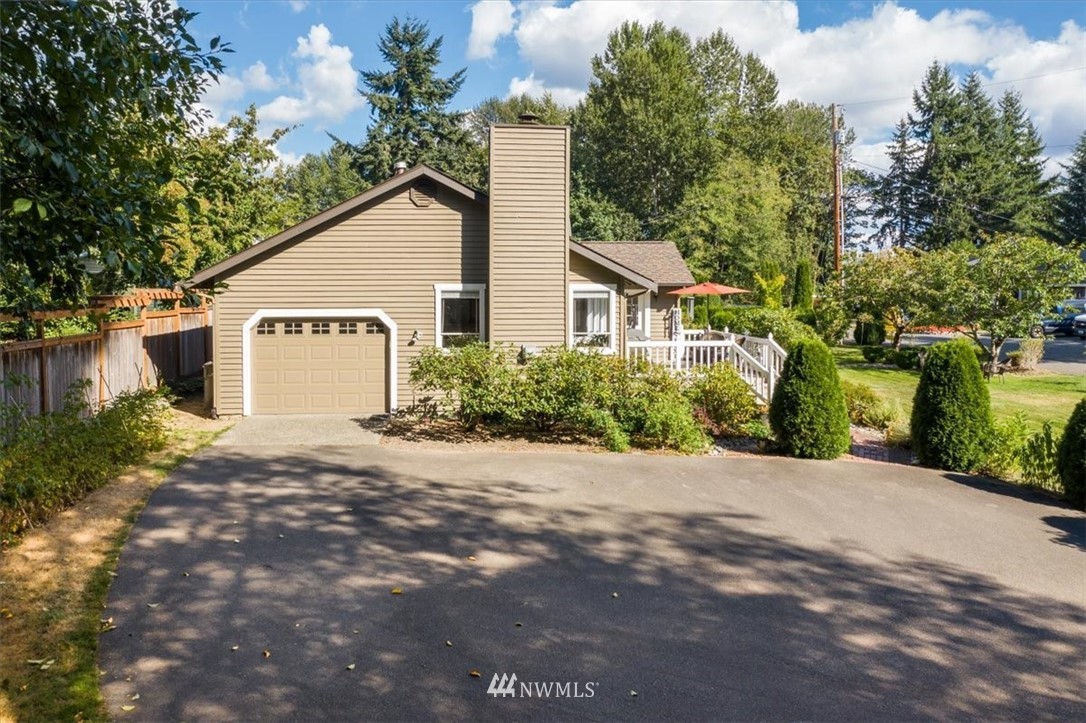 1919 243rd Place Southwest Bothell, WA 98021 - Photo 31 of 39 a view of a house with a yard and large tree