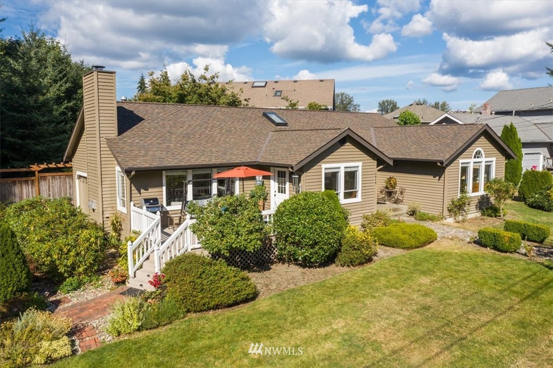 1919 243rd Place Southwest Bothell, WA 98021 - Photo 34 of 39 a view of house with yard and sitting area