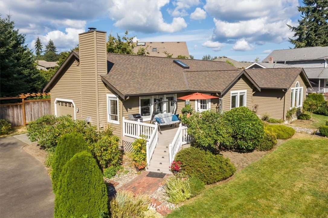 1919 243rd Place Southwest Bothell, WA 98021 - Photo 38 of 39 a front view of a house with a yard