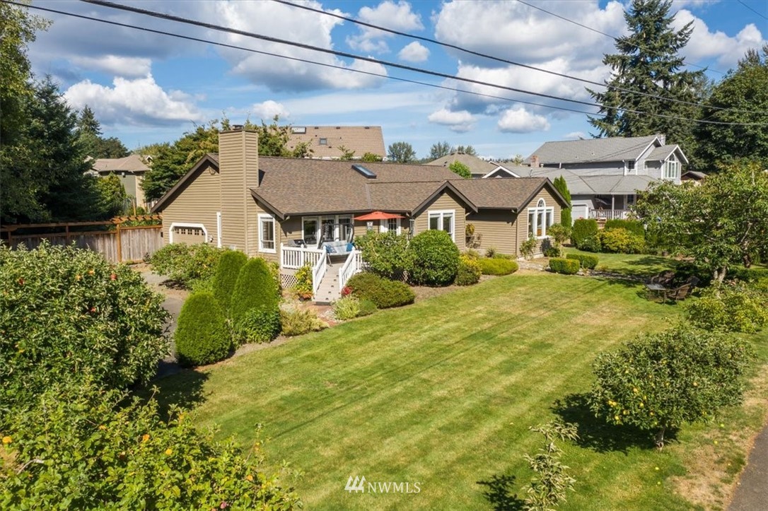 1919 243rd Place Southwest Bothell, WA 98021 - Photo 39 of 39 a view of a white house with a big yard plants and large trees