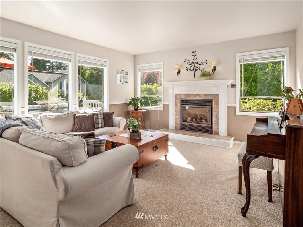 1919 243rd Place Southwest Bothell, WA 98021 - Photo 5 of 39 a living room with furniture and a fireplace