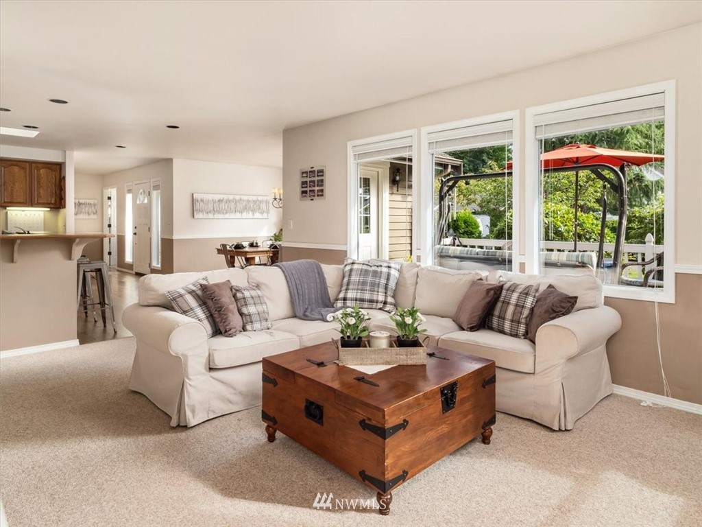1919 243rd Place Southwest Bothell, WA 98021 - Photo 6 of 39 a living room with furniture and a large window