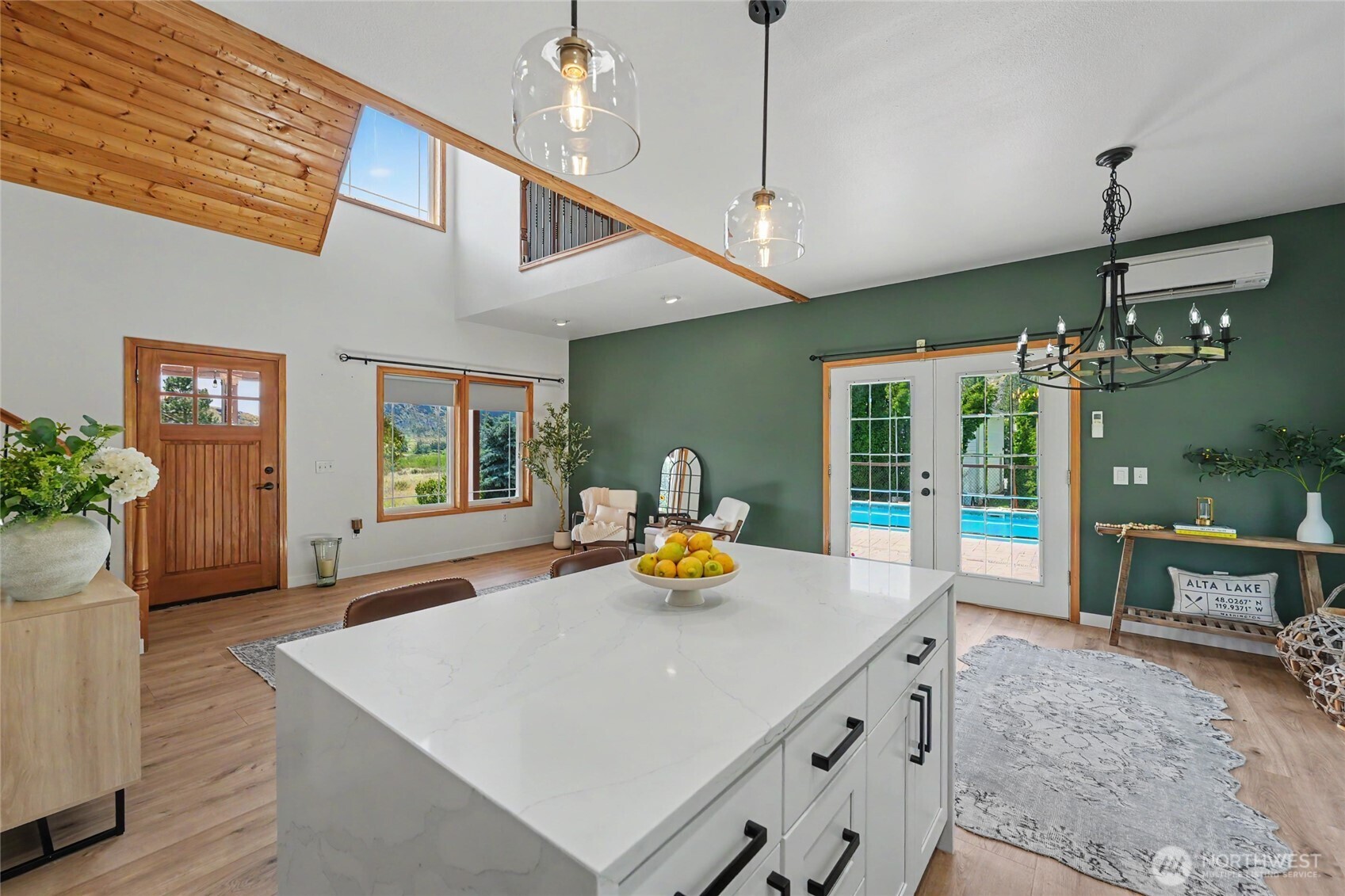 93 Golf Course Drive Pateros, WA 98846 - Photo 11 of 34 a kitchen with a sink a counter and chairs