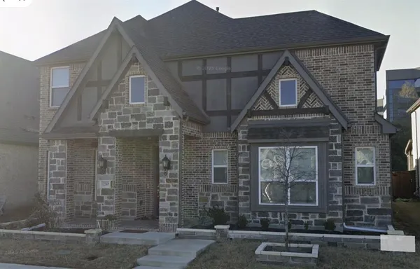 a front view of a house with parking