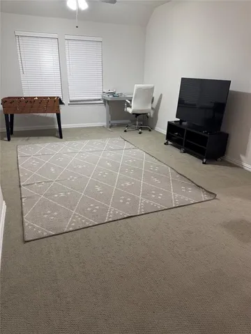 a kitchen with stainless steel appliances a stove a sink a table and chairs