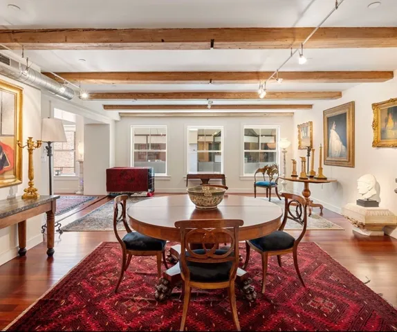 a bedroom with a bed and a lamp with window