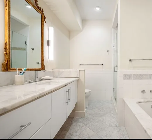 a bathroom with a bathtub and shower