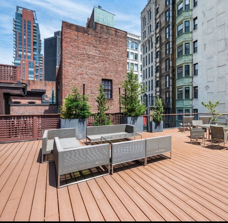 1-3 Winter Place, Unit 3 Boston, MA 02108 - Photo 21 of 23 a view of a patio with couches and potted plants