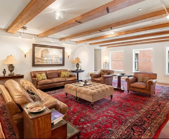 a living room with furniture and kitchen view