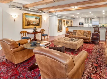 a kitchen with stainless steel appliances granite countertop a stove top oven a sink dishwasher and a refrigerator