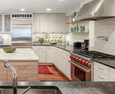 a kitchen with appliances cabinets and a sink