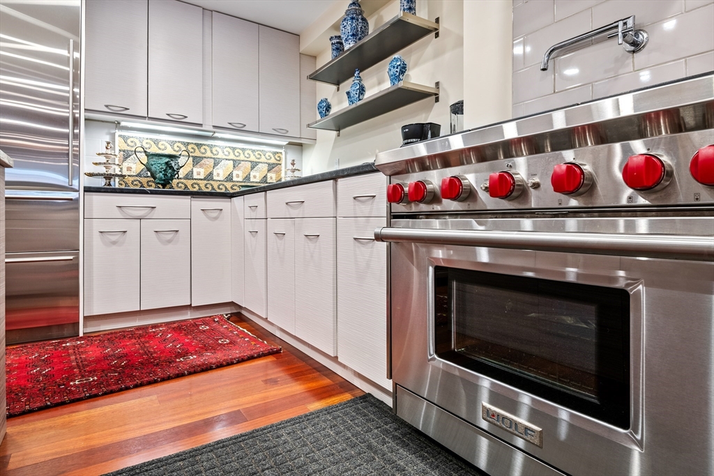 1-3 Winter Place, Unit 3 Boston, MA 02108 - Photo 9 of 23 a stove top oven sitting inside of a kitchen