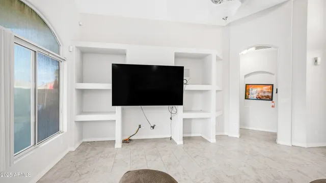 a kitchen with stainless steel appliances granite countertop a refrigerator sink stove microwave and cabinets