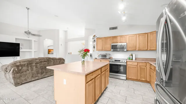 a view of a room with gym equipment and windows