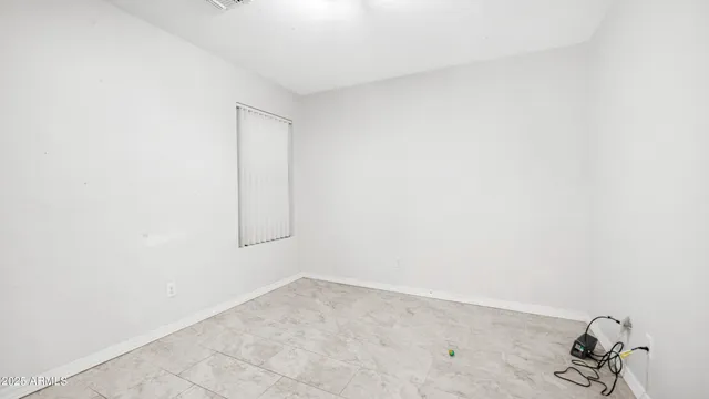 a bathroom with a sink a toilet and shower curtain