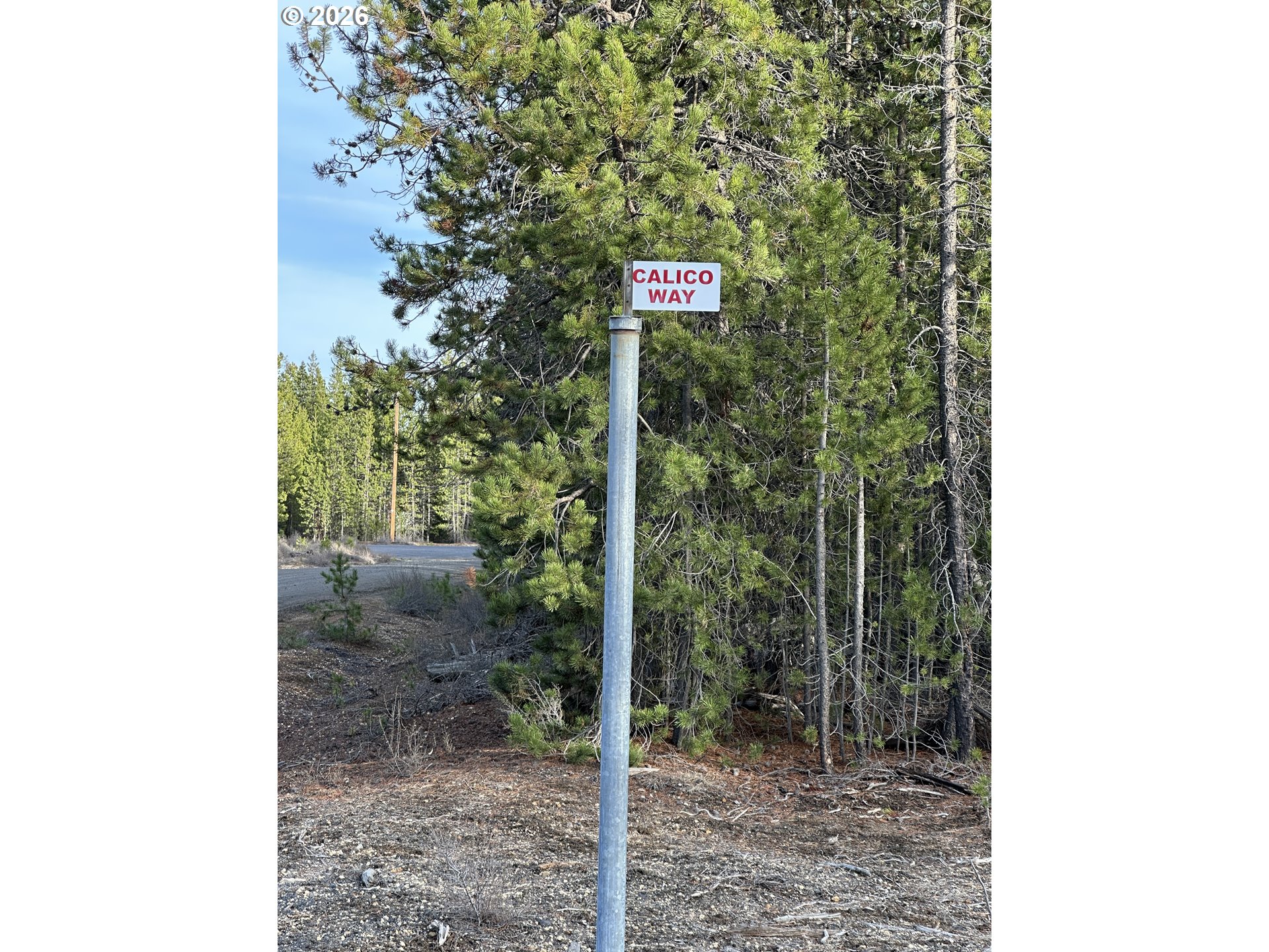 2 2 Rivers Road, Unit TL 3300 Crescent Lake, OR 97733 - Photo 11 of 12 a street sign sitting on the side of a wall