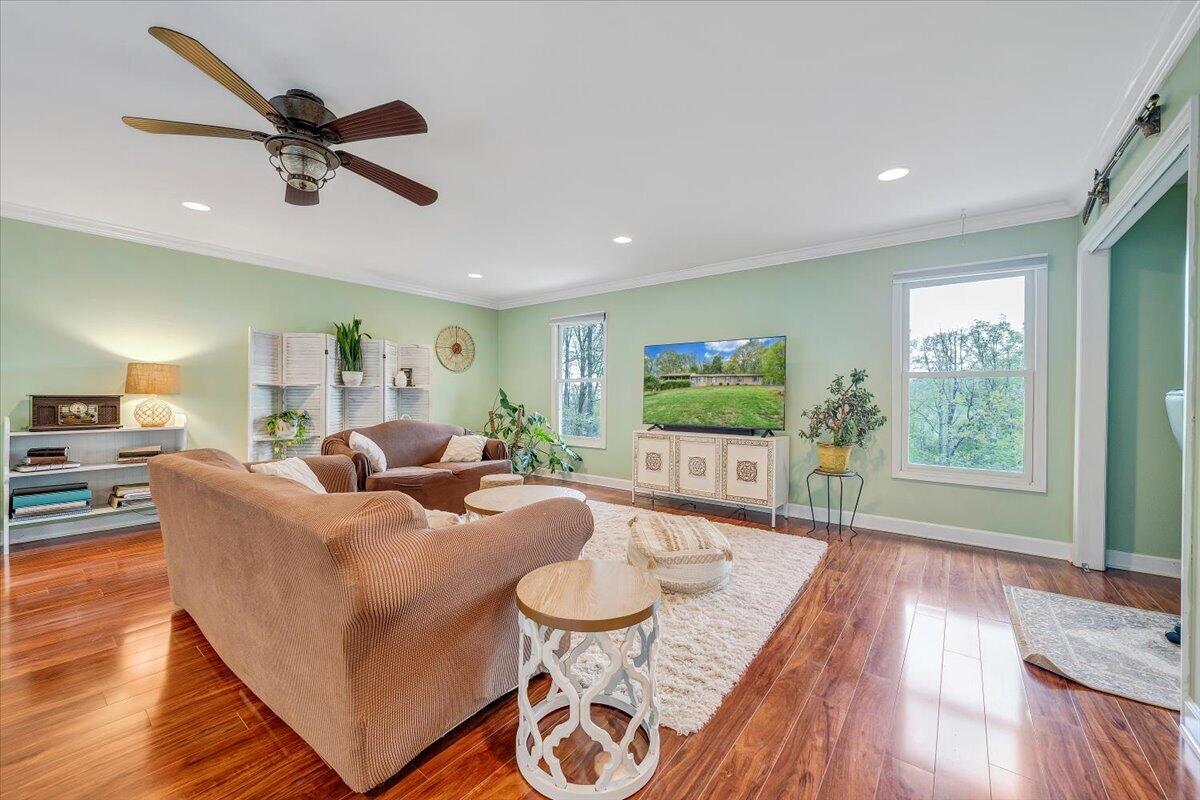 856 Ridge Mountain Drive Boones Mill, VA 24065 - Photo 20 of 66 a living room with furniture and a large window