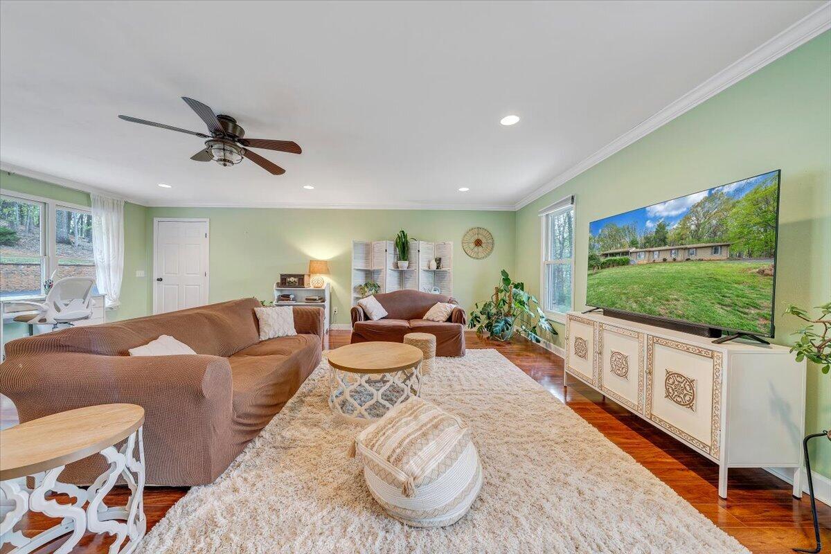 856 Ridge Mountain Drive Boones Mill, VA 24065 - Photo 21 of 66 a living room with furniture and a flat screen tv