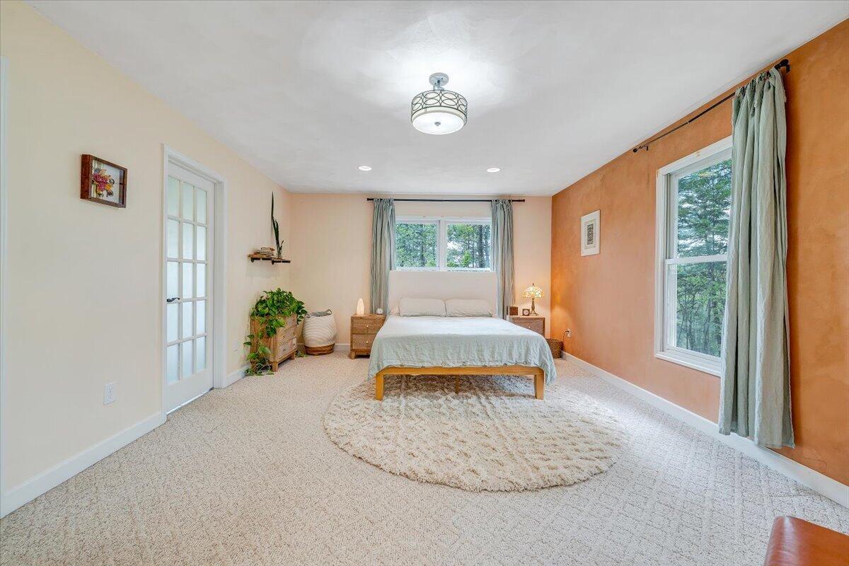 856 Ridge Mountain Drive Boones Mill, VA 24065 - Photo 24 of 66 a bedroom with furniture and a large window