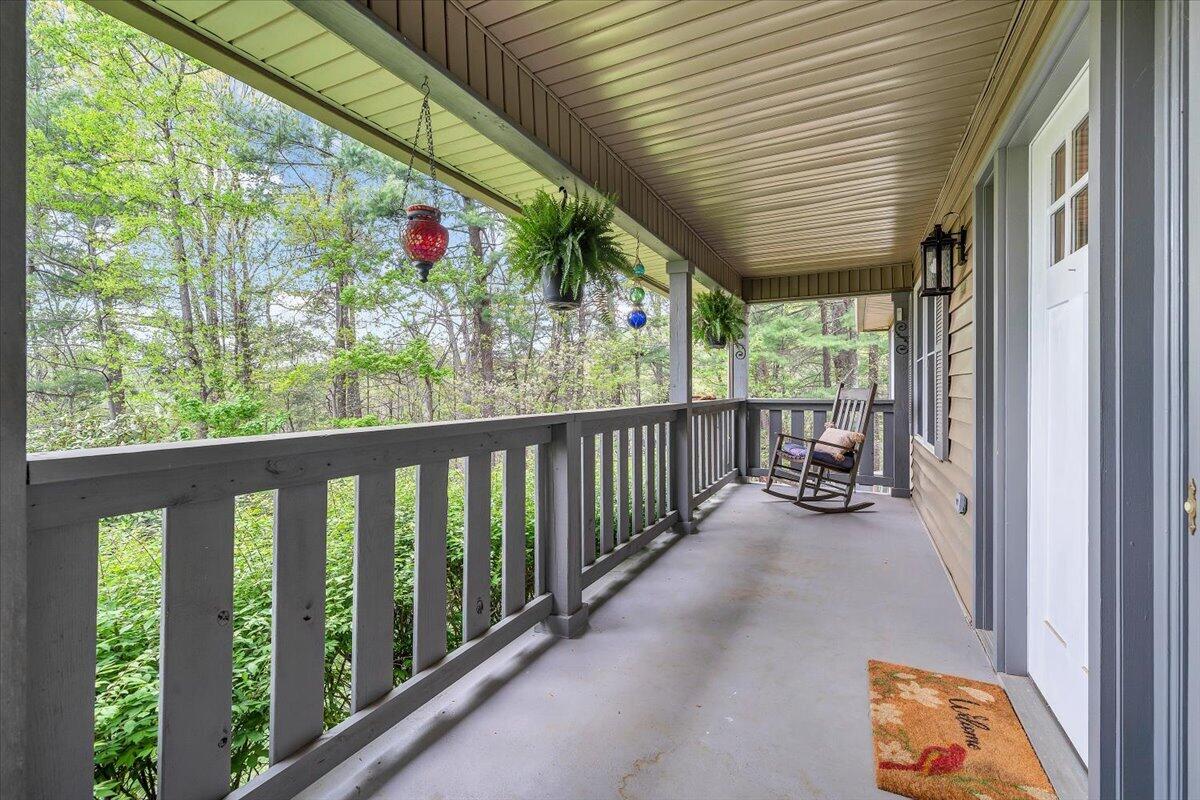 856 Ridge Mountain Drive Boones Mill, VA 24065 - Photo 3 of 66 a view of a porch with wooden floor and furniture