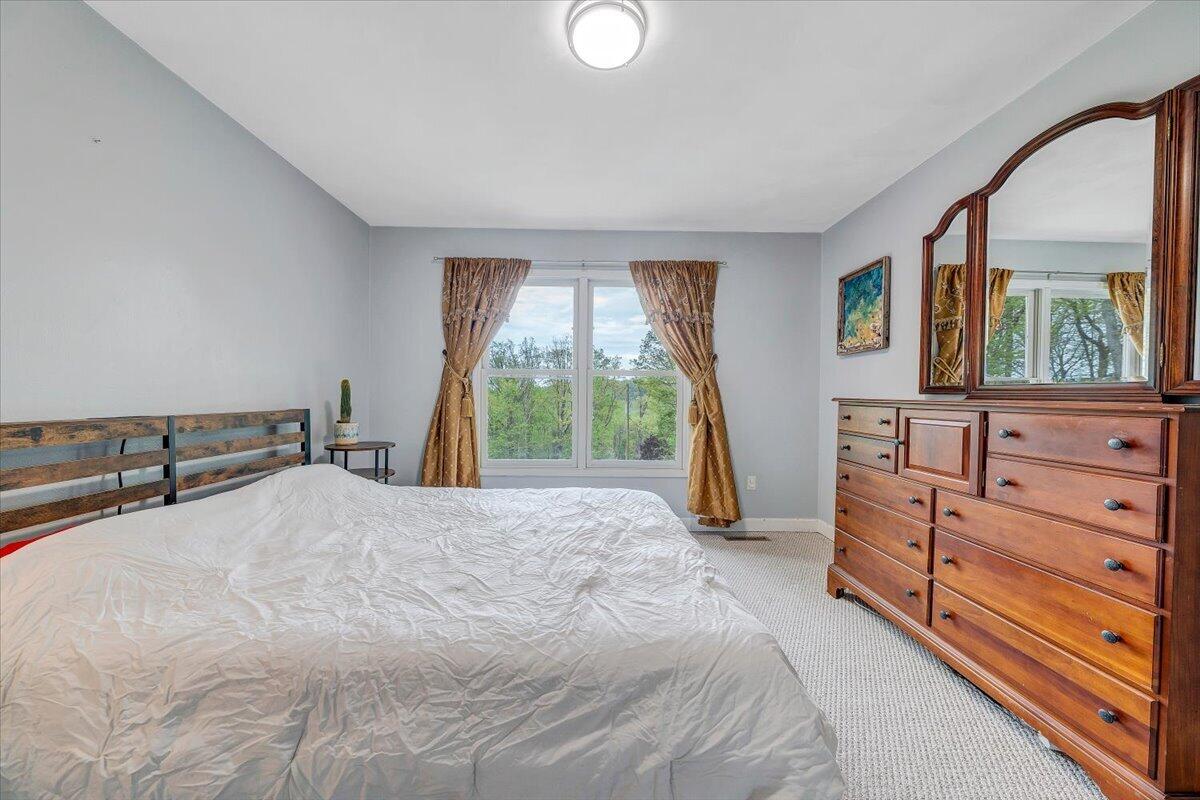 856 Ridge Mountain Drive Boones Mill, VA 24065 - Photo 36 of 66 a bed room with a bed and a window