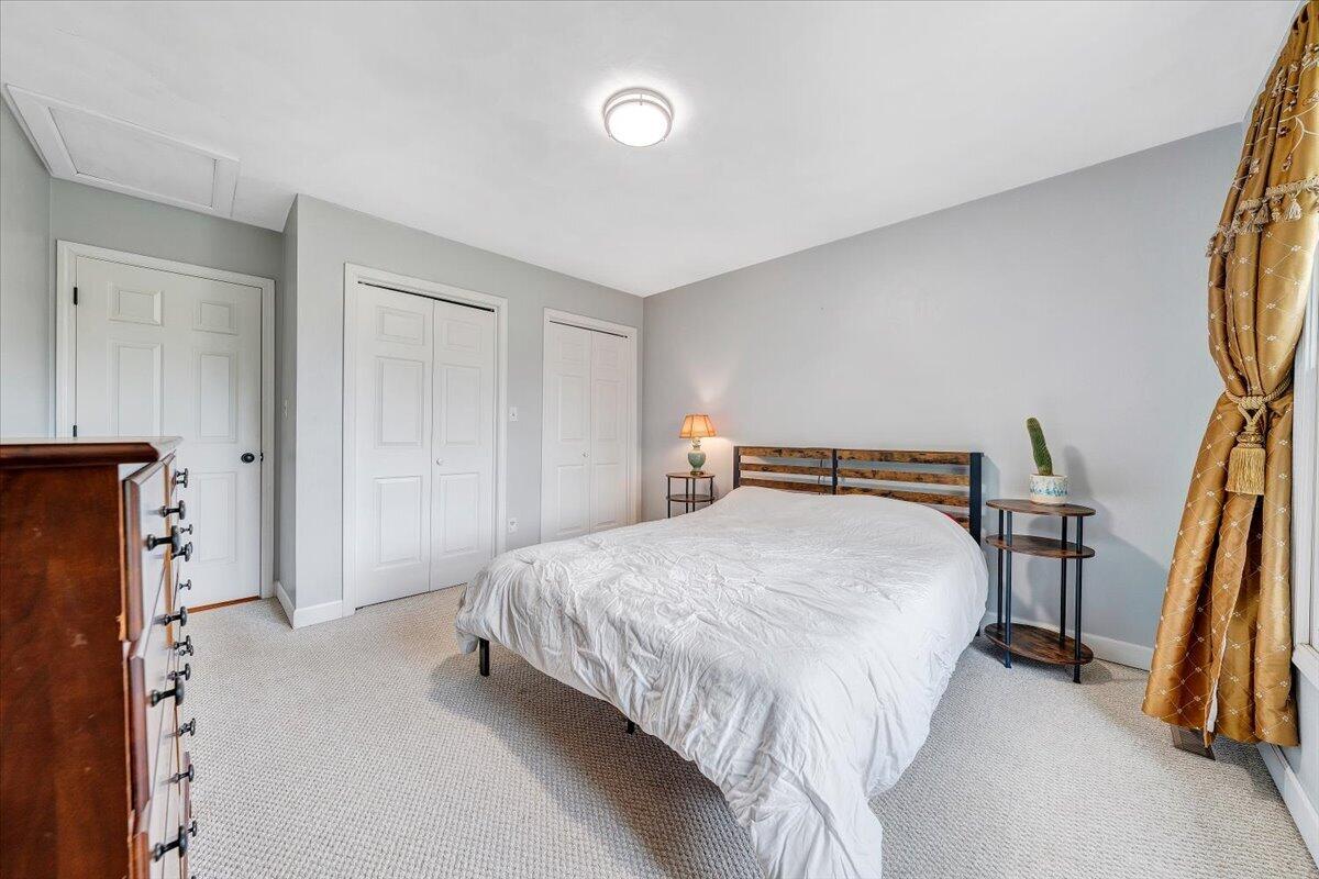 856 Ridge Mountain Drive Boones Mill, VA 24065 - Photo 37 of 66 a spacious bedroom with a bed and a walk in closet