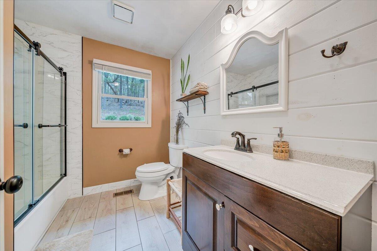 856 Ridge Mountain Drive Boones Mill, VA 24065 - Photo 38 of 66 a bathroom with a sink a toilet and shower
