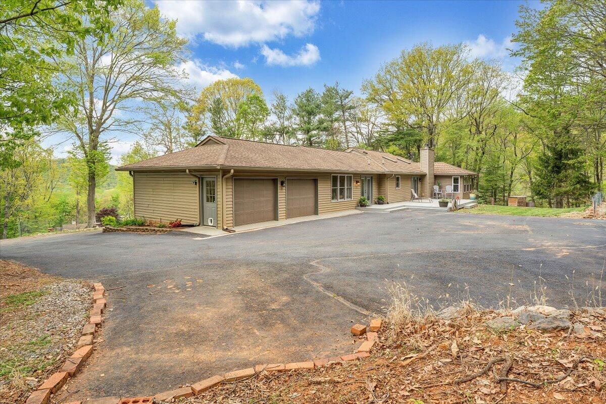 856 Ridge Mountain Drive Boones Mill, VA 24065 - Photo 57 of 66 a view of a house with a outdoor space