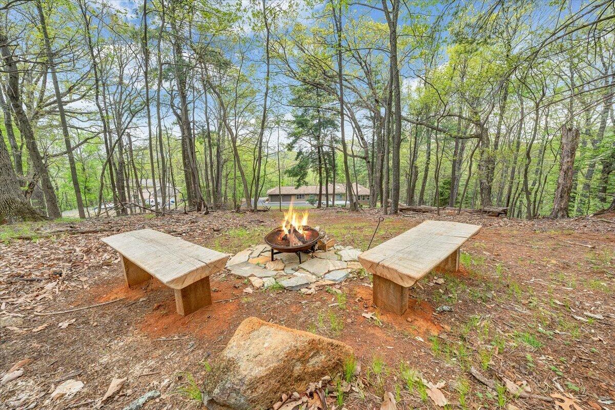 856 Ridge Mountain Drive Boones Mill, VA 24065 - Photo 59 of 66 a view of a patio with a table and chairs in a patio