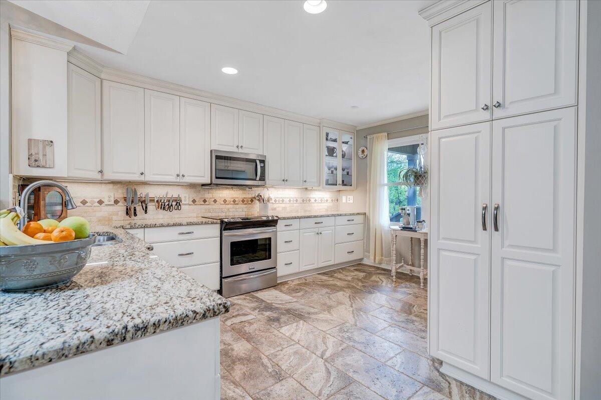 856 Ridge Mountain Drive Boones Mill, VA 24065 - Photo 6 of 66 a kitchen with a stove a sink and a refrigerator