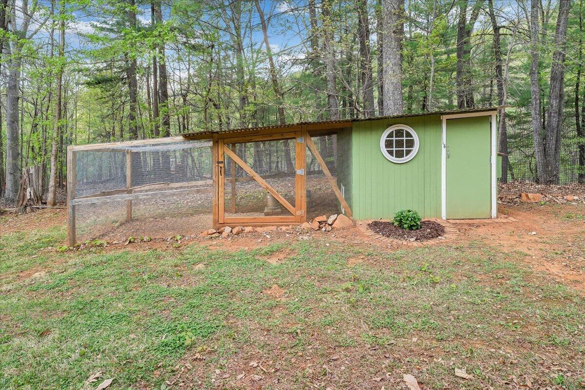 856 Ridge Mountain Drive Boones Mill, VA 24065 - Photo 62 of 66 a view of backyard with a barn and large trees