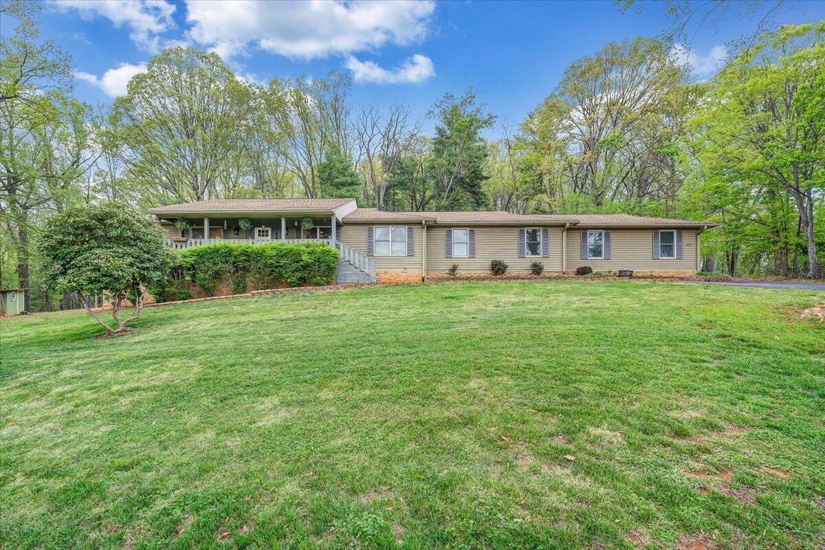 856 Ridge Mountain Drive Boones Mill, VA 24065 - Photo 64 of 66 a view of a house with a yard and sitting area