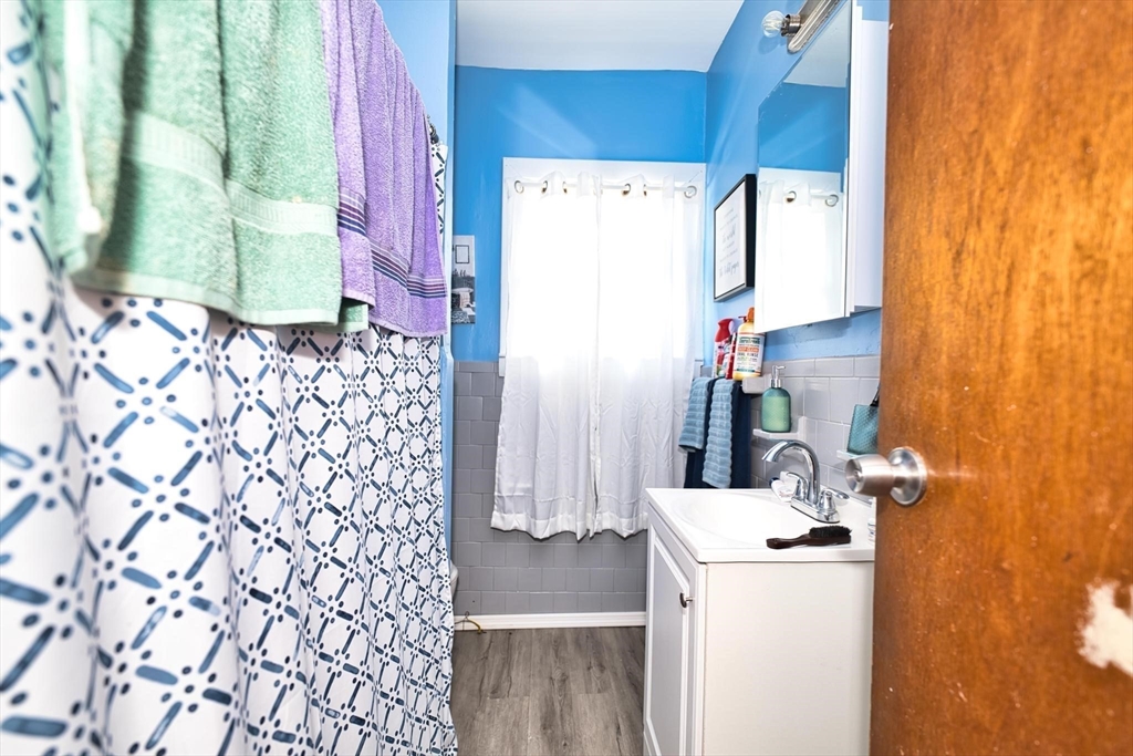 232 Alden Street Fall River, MA 02723 - Photo 10 of 34 a room with a refrigerator and washer