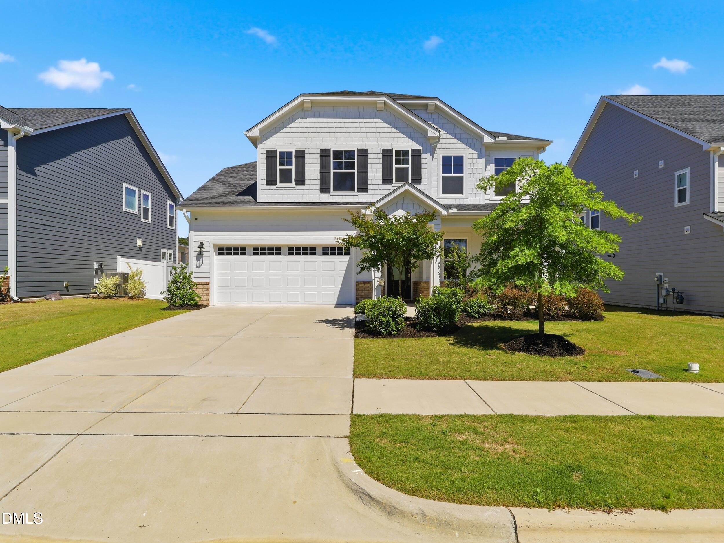 2709 Womble Ridge Drive New Hill, NC 27562 - Photo 59 of 60 a front view of a house with a yard