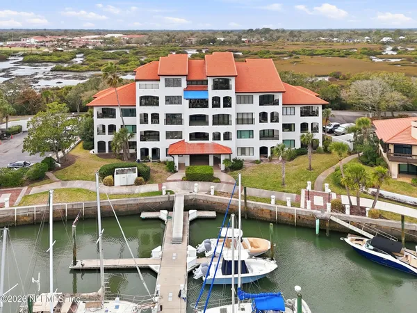 a potted plant sitting in front of a door
