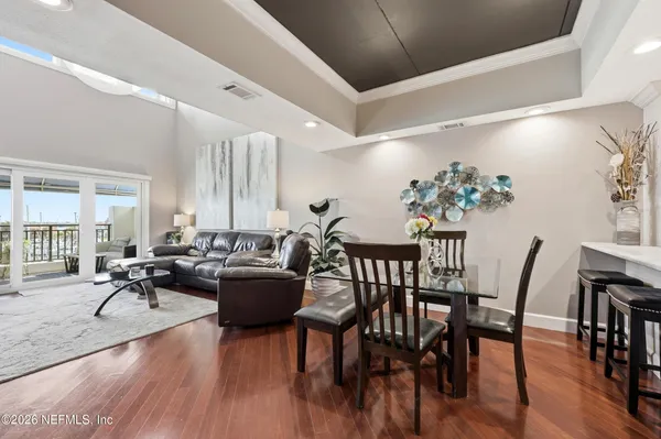 a living room with furniture and a book shelf