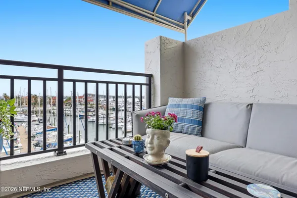 an aerial view of a residential apartment building with a yard