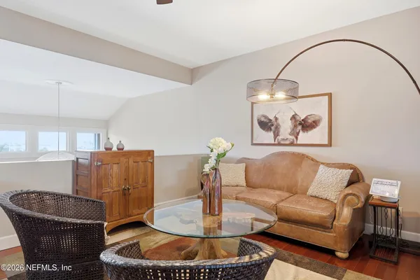 a view of a swimming pool with a lounge chair