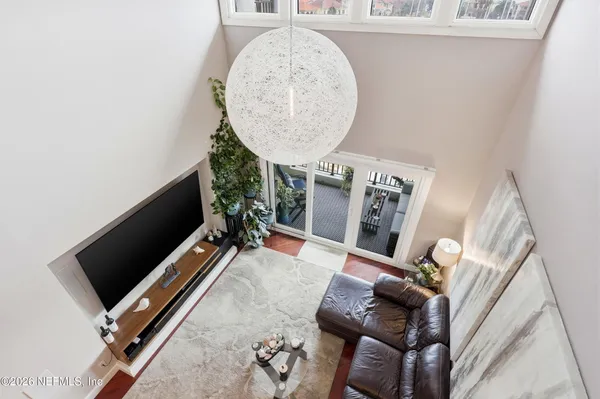 an aerial view of residential house with outdoor space and swimming pool