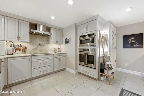 a kitchen with sink and cabinets