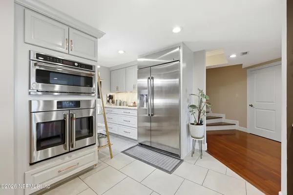 a view of living room with furniture and a flat screen tv