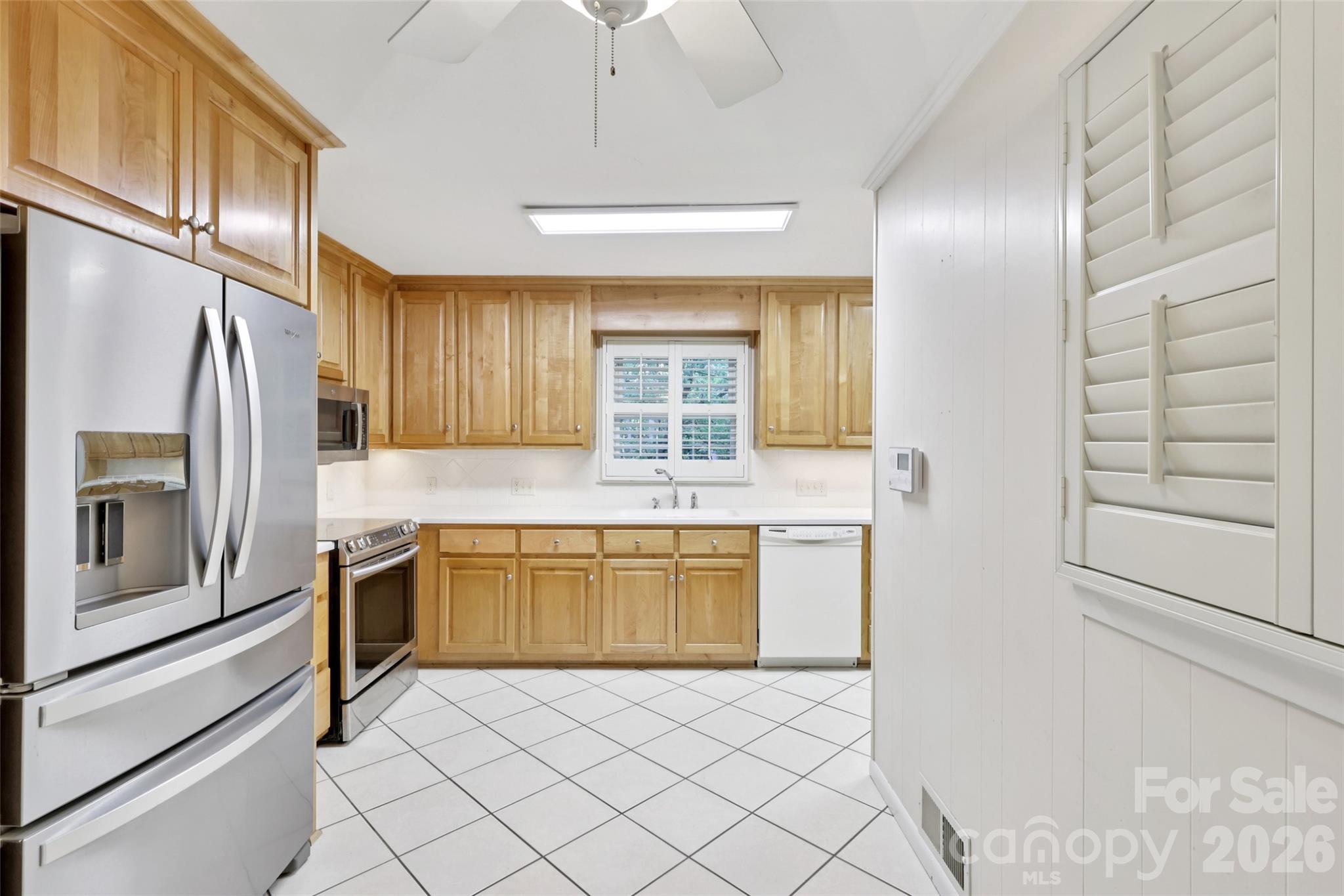 1002 Ridge Street Albemarle, NC 28001 - Photo 15 of 45 a kitchen with a refrigerator a stove top oven and a refrigerator