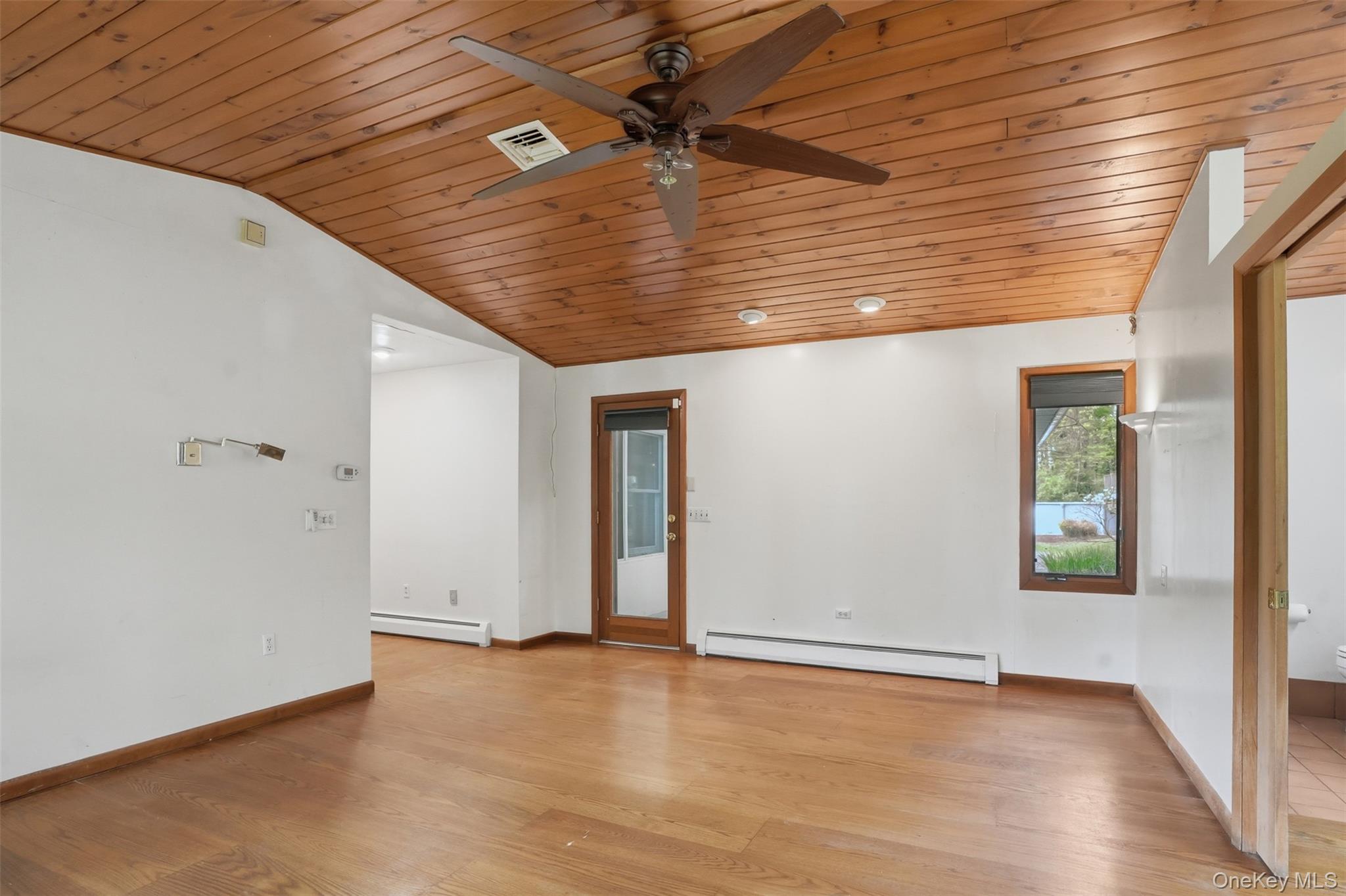 435 Samsonville Road Kerhonkson, NY 12446 - Photo 24 of 37 an empty room with wooden floor and windows