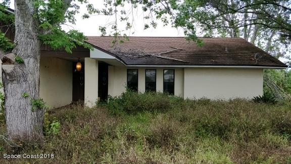 520 Atz Road Malabar, FL 32950 - Photo 2 of 15 a side view of house with yard